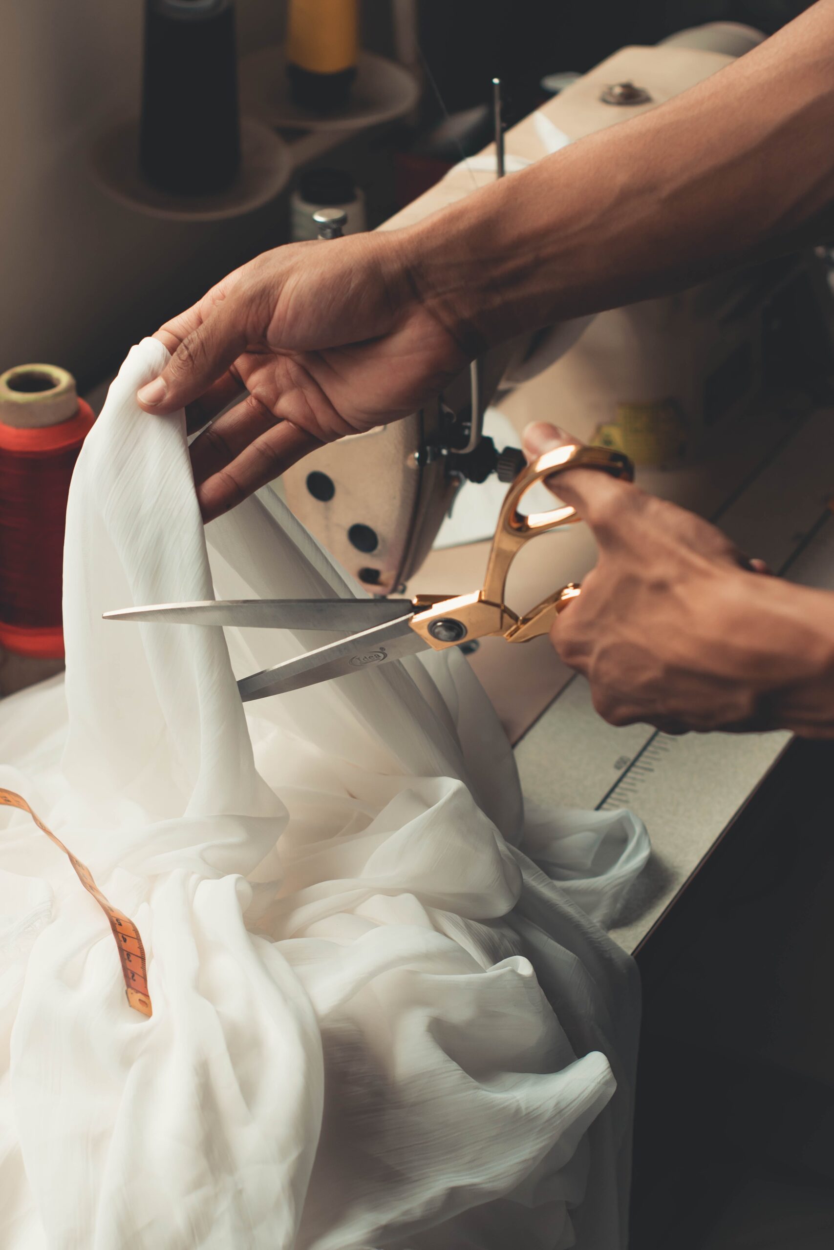 Person Cutting White Cloth